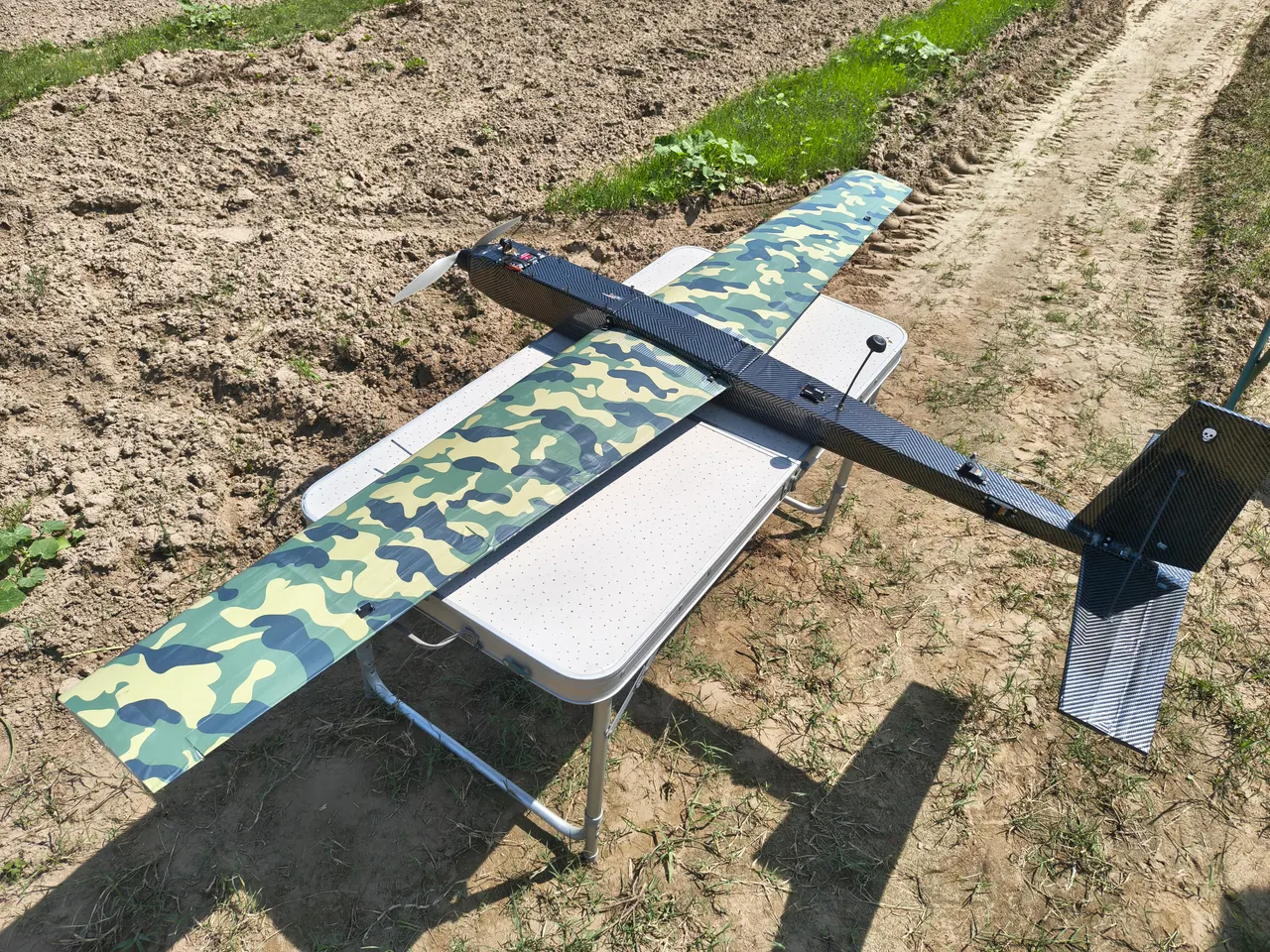 The XO11 2200 mm UAV in the field, seen from the tail